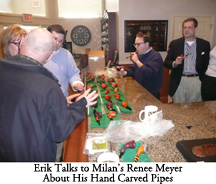 Erik Talks to Milan's Renee Meyer About His Hand Carved Pipes While Nicholas, Alan, and Scott Listen